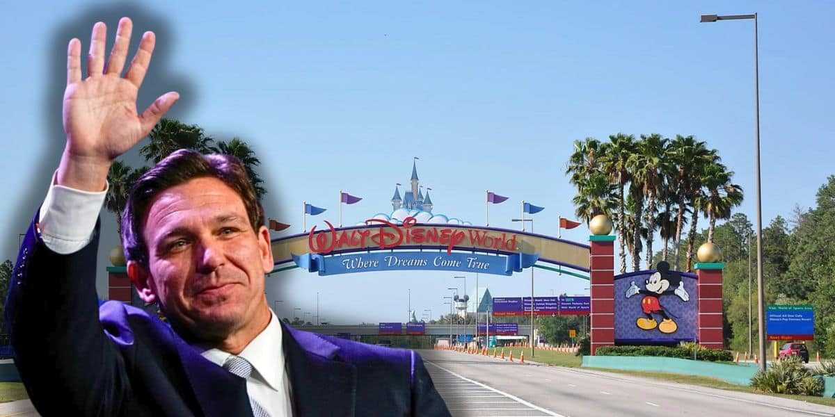 Ron DeSantis in front of Walt Disney World Sign