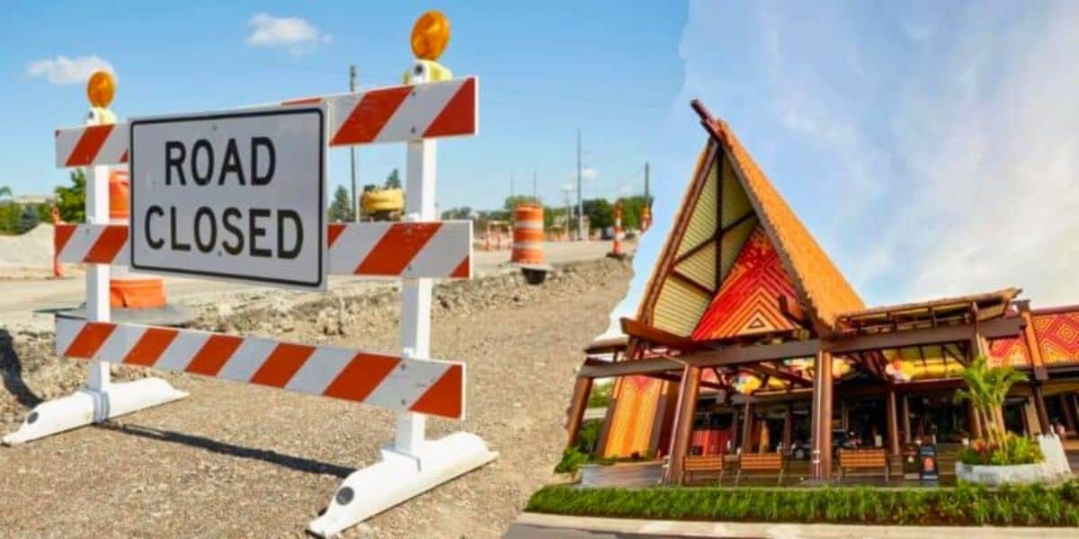 A split image showing road construction on the left with an orange and white "Road Closed" sign, and a building with Polynesian architectural design reminiscent of Disney's resort style on the right, featuring an A-frame structure and vibrant decorations.