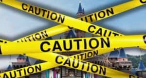 An image showing a castle behind multiple yellow "Caution" tapes crossing each other diagonally. The tapes obstruct a clear view of the castle, suggesting restricted access—much like a scene where Disney magic is temporarily off-limits.