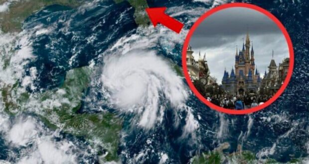 A satellite image shows a large hurricane over the Gulf of Mexico approaching the southeastern United States. An inset photo, highlighted with a red circle and arrow, depicts a crowded day at Disney World with its prominent castle under cloudy skies.