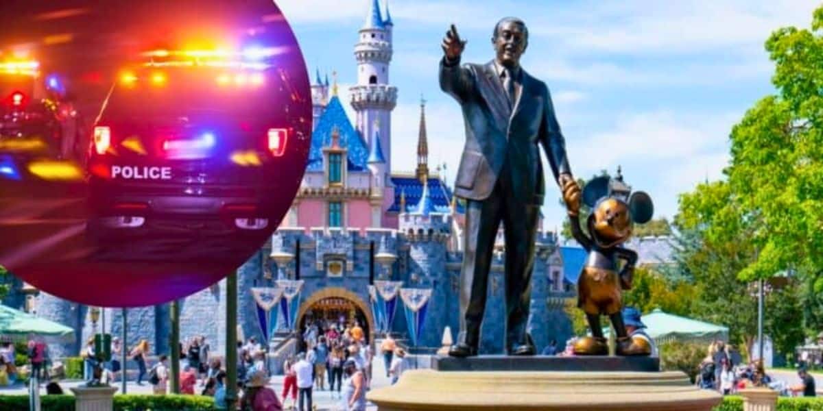 A statue of Walt Disney holding Mickey Mouse's hand stands in front of Sleeping Beauty Castle at Disneyland. Inserted in the image is a photo of a police car with flashing lights at night. Visitors walk around the statue and castle in the background.