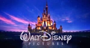 A serene twilight sky backs the iconic fairy tale castle as the luminous walt disney pictures logo takes center stage.