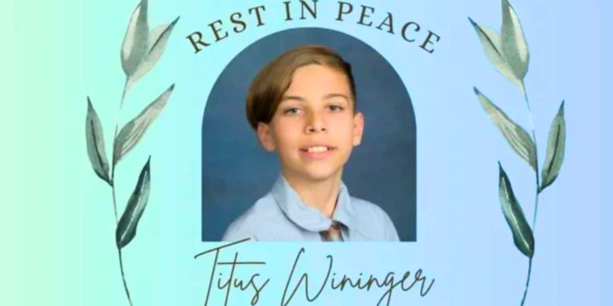 A memorial image with a photo of a young boy wearing a light blue shirt and tie, framed by decorative leaves on both sides. Text above the photo reads "Rest in Peace," and the name "Titus Wininger, 11 year old dies at Wild River Water Park in Irvine California," is written below in cursive.