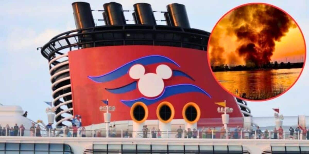 A cruise ship with Disney's iconic red funnel, featuring a white Mickey Mouse logo, sails calmly. Inset is a circular image of a large fire with thick black smoke billowing into the sky near a body of water.