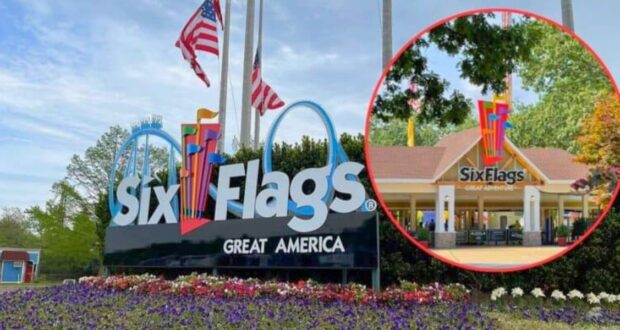 The image shows the entrance sign for Six Flags Great America, which features colorful flags and the park's logo. In the background are trees and American flags. The inset highlights the entrance gate, also displaying the park's logo. Flower beds line the foreground.