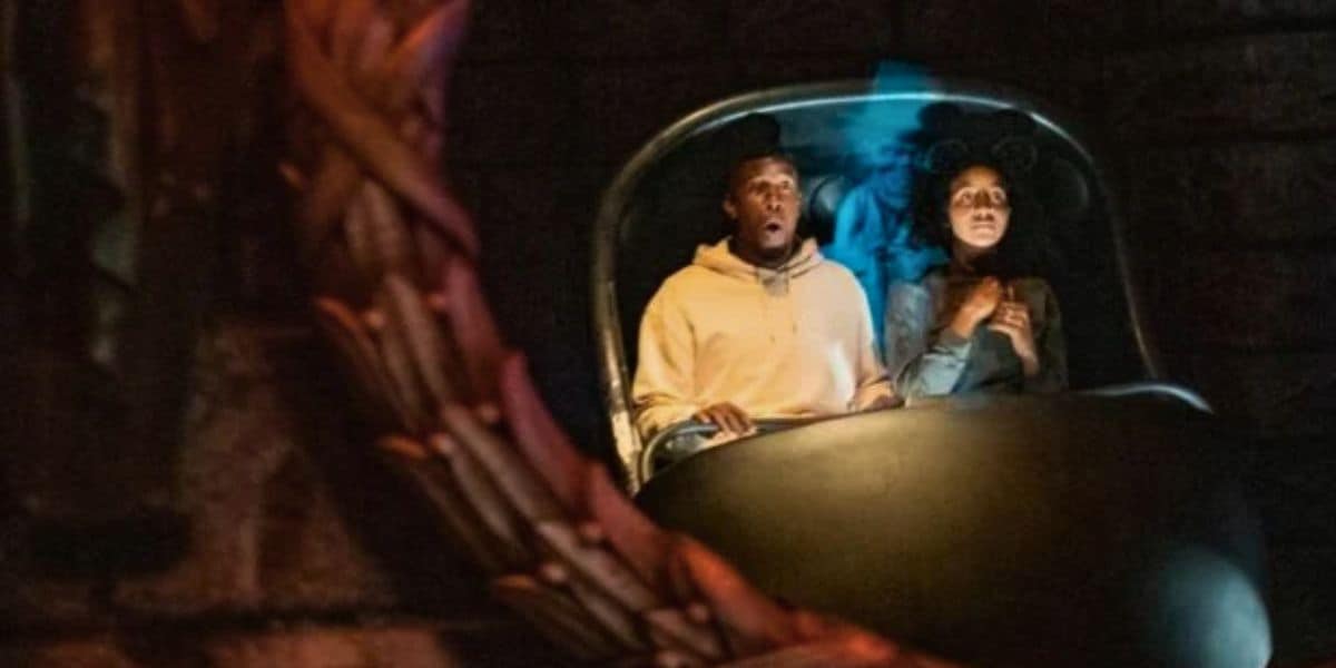 A man and woman ride in a Doom Buggy on the Haunted Mansion at Disneyland