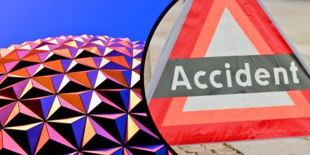 An accident sign in front of the Spaceship EPCOT ball at Disney World next to Test Track.