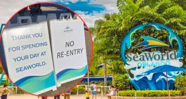 Two signs are displayed, one thanking visitors for spending their day at SeaWorld and the other signaling no re-entry. In the background, a large SeaWorld Orlando sign is surrounded by greenery and people are seen walking around.