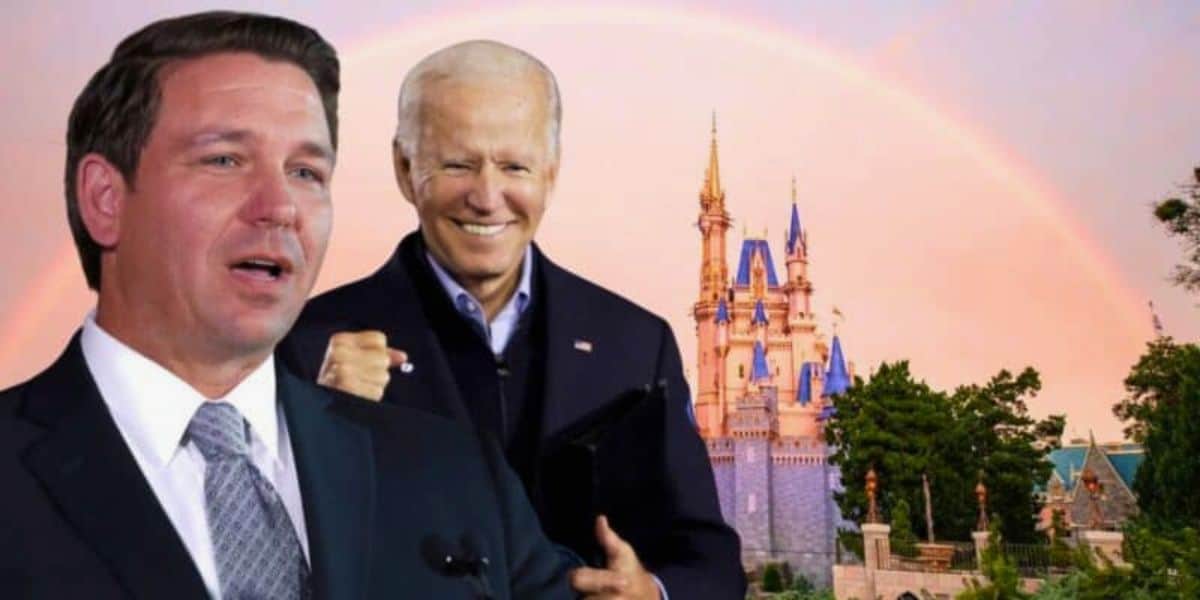 A composite image showing two men in front of a Disney castle with a rainbow in the background. The man on the left is speaking, wearing a suit and tie. The man on the right is smiling and raising his fist, also in a suit. Trees are visible in the foreground.