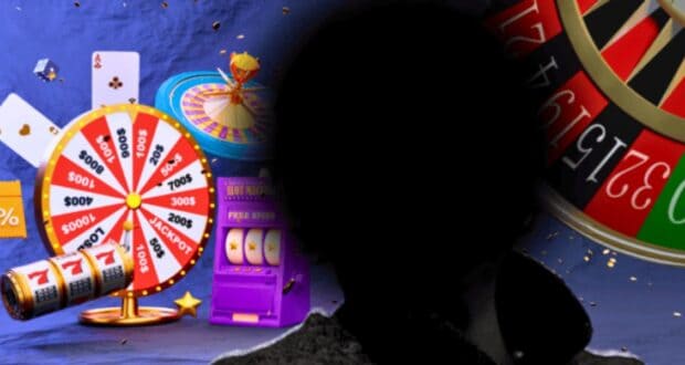 A silhouette of a person stands in front of a colorful casino-themed background. The backdrop features a large prize wheel with monetary amounts, spinning slot machine reels, playing cards, and a roulette wheel. The scene is vibrant with a festive gambling atmosphere.
