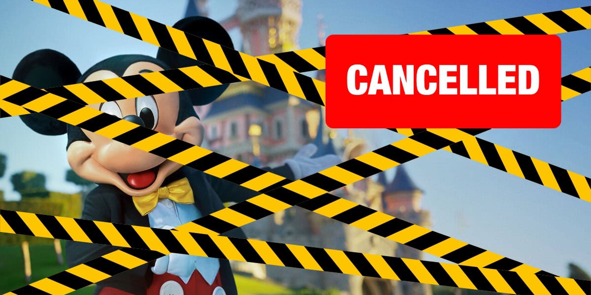 A cartoon mouse character dressed in a suit stands in front of a castle. The image is overlaid with diagonal yellow and black caution tape, and a large red sign with the word "CANCELLED" covers part of the scene.