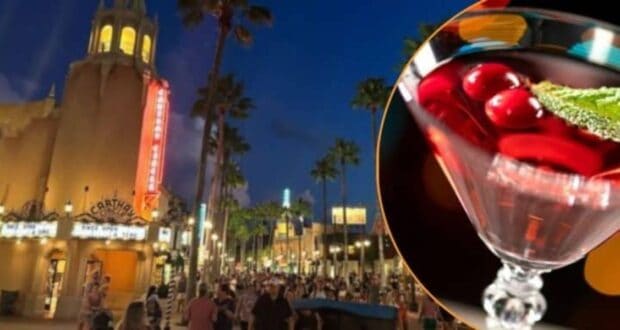 A vibrant street scene at dusk with a tower and marquee lights in the background, crowded with people. In the foreground is a close-up of a martini glass filled with a red drink, garnished with cherries and a mint leaf.