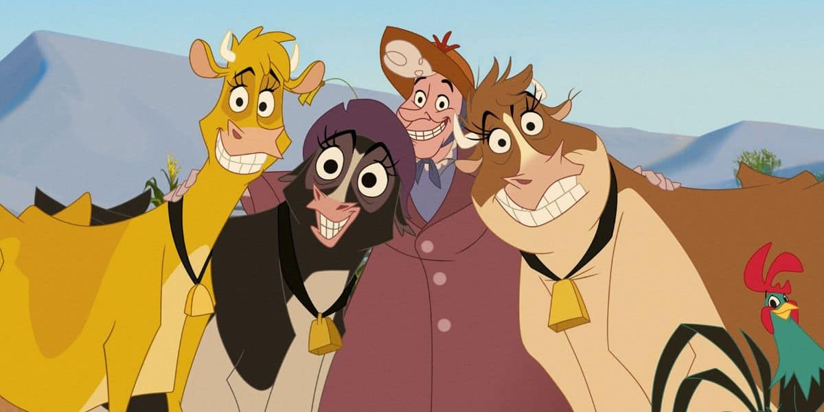 A group of animated cows and a human stand together smiling in a cheerful scene. Each cow wears a bell around its neck, and a rooster can be seen on the right. The background features a landscape with distant hills.