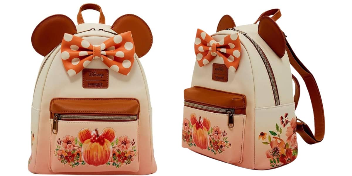 A cream and pink backpack with Mickey Mouse ears and a large, orange polka dot bow. The front and side pockets feature floral designs and a Mickey pumpkin illustration. Brown accents include a top handle and straps.