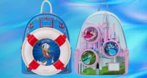 Two Disney-themed backpacks: one blue with a nautical design featuring Donald Duck and a lifebuoy, and the other pink with a castle and circular windows displaying Disney princesses. Both are set against a soft blue background.