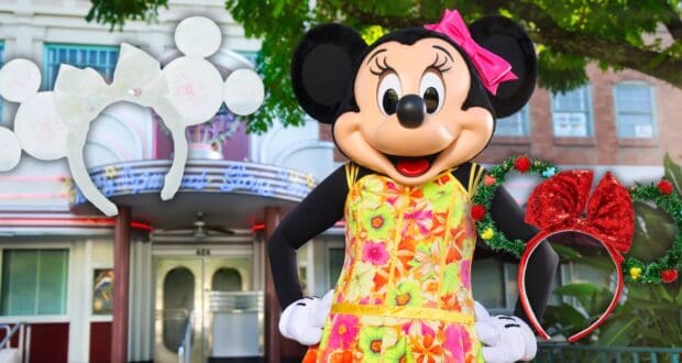A person in a Minnie Mouse costume stands outdoors, wearing a vibrant floral dress. Minnie headbands, one with white ears and the other with Christmas decorations, float nearby. A building is in the background.