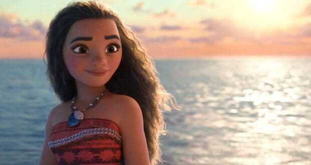 An animated girl with long, wavy hair stands on a boat in the ocean, wearing a red patterned dress and a seashell necklace. The sun sets behind her, casting a warm glow over the water.