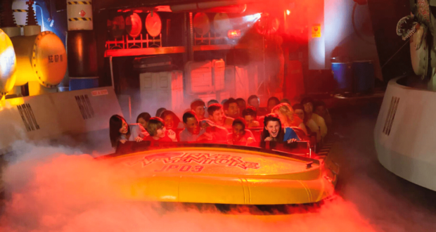 Passengers on the Jurassic Park River Adventure attraction at Universal Studios