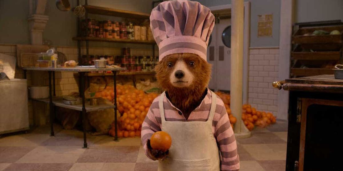 Paddington Bear in the jail kitchen in 'Paddington 2'