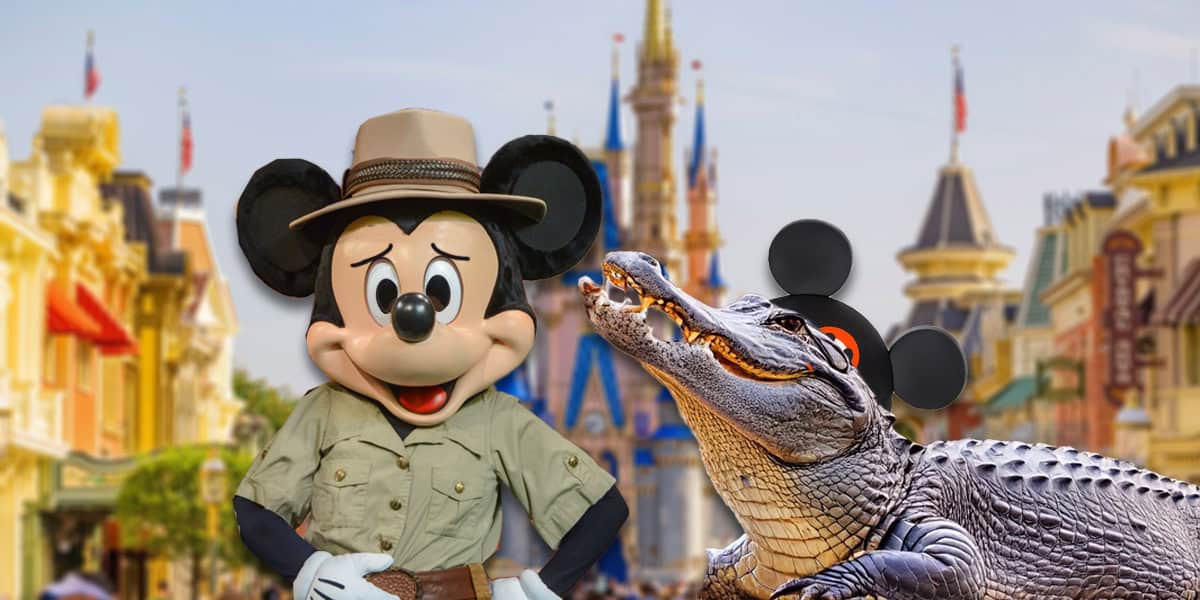 Mickey Mouse dressed as a park ranger stands next to an alligator wearing Mickey ears, with a castle and colorful buildings in the background, resembling a theme park setting.
