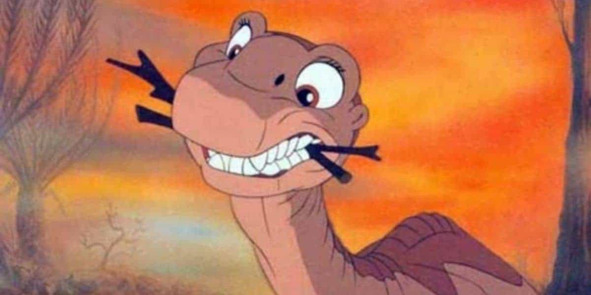 Littlefoot with sticks in his mouth in 'The Land Before Time'