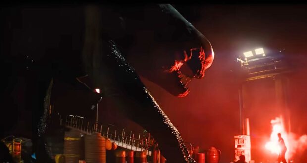 The D-Rex roaring in red light in 'Jurassic World Rebirth'