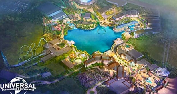 A colorful aerial illustration of a theme park with a large blue lake at the center, surrounded by rides, roller coasters, and buildings. The Universal Destinations & Experiences logo is in the bottom left corner.