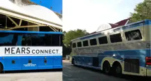 Two blue buses parked outdoors: on the left, a modern bus labeled "MEARS CONNECT"; on the right, a vintage-style bus with white and blue stripes and large windows, parked near trees.