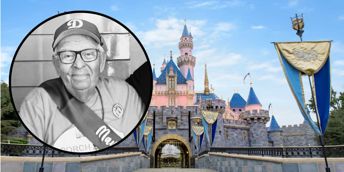 A black-and-white portrait of an elderly man in a cap and glasses is shown in a circular frame overlaid on a color photo of Disneyland’s Sleeping Beauty Castle. The man wears a sash and a shirt with a visible "D" on his cap.