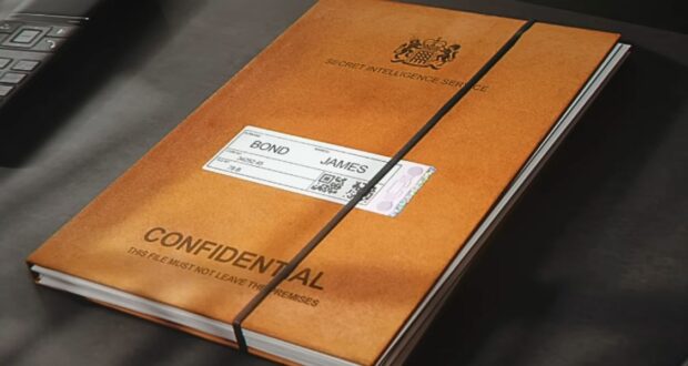 A brown folder labeled "CONFIDENTIAL" and "SECRET INTELLIGENCE SERVICE" lies on a desk, secured with a black elastic band; a label reads "Bond, James Bond. Taken from the "007 First Light" trailer