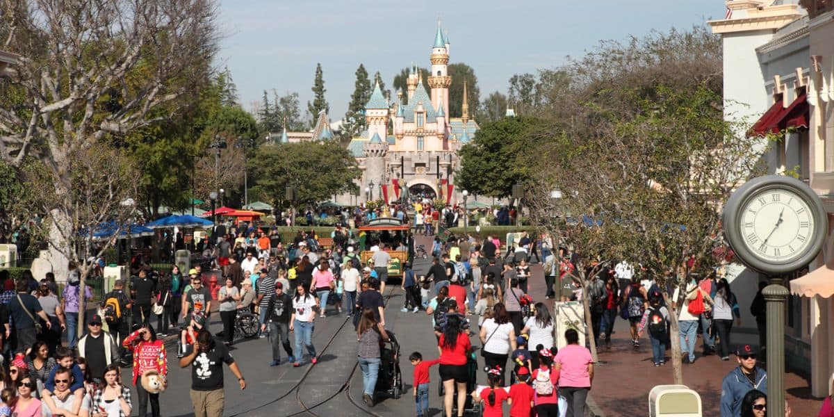Guests on Main Street, U.S.A., at Disneyland Park.
