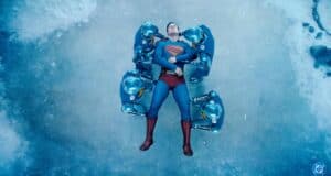 Superman (David Corenswet) being carried by his robots