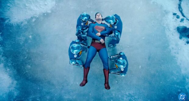 Superman (David Corenswet) being carried by his robots
