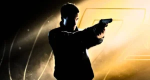 A man stands in dramatic lighting, holding a gun with both hands and aiming to the right. The background features yellow and black tones with the faint outline of the numbers "007.