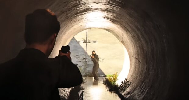 James Bond aiming at an enemy in a tunnel in "007 First Light"