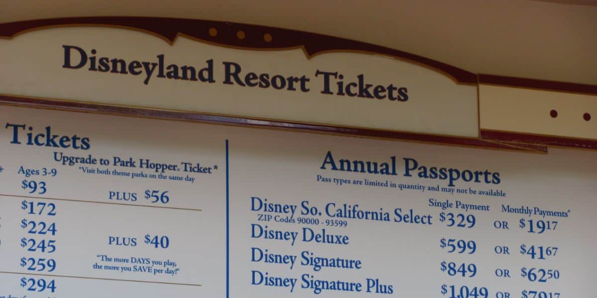 A sign at Disneyland Resort displays prices for theme park tickets.