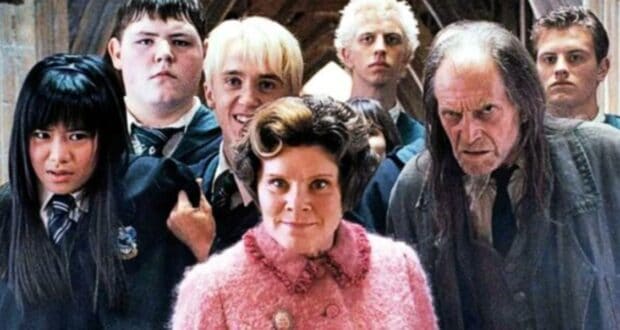 Dolores Umbridge (Imelda Staunton), Draco Malfoy (Tom Felton), and other Harry Potter bad guys ringed around a doorway.