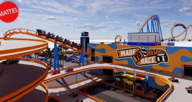 Hot Wheels coaster and cars at Mattel Adventure Park Florida, racing under blue skies—Disney’s new theme park competition.