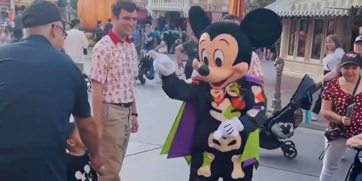 Mickey Mouse pointing at a father