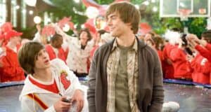 Two teens party outside amid crowds in Disney-inspired red and white, echoing the buzz after a Disney Channel star scandal.
