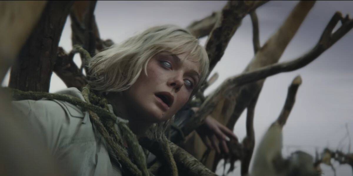 A ghostly woman with wild hair and pale eyes appears trapped in twisting vines, like a scene from a mysterious Disney promotional event.