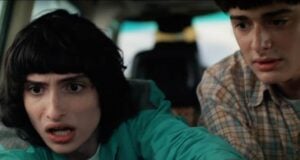 Two teens in a car appear nervous, capturing the suspenseful vibe of Stranger Things Season 5 as seen at Universal Studios.
