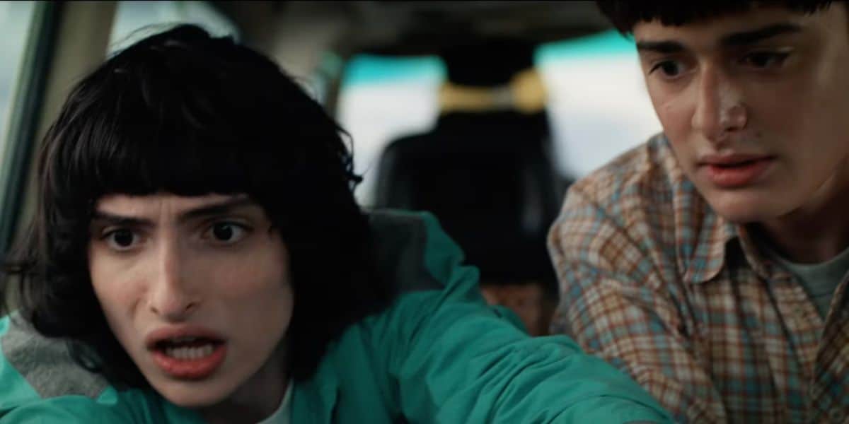 Two teens in a car appear nervous, capturing the suspenseful vibe of Stranger Things Season 5 as seen at Universal Studios.