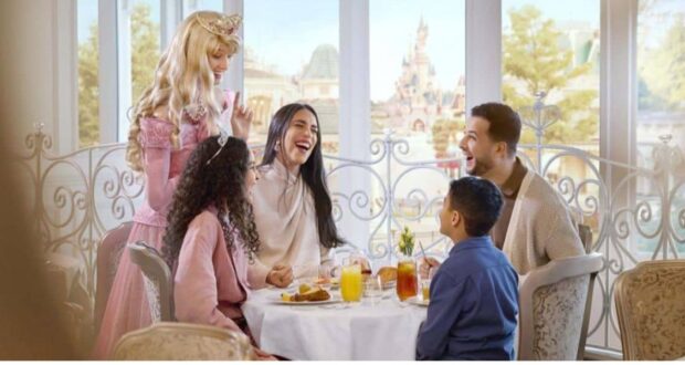 Guests with Sleeping Beauty inside Disneyland Hotel