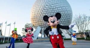 Mickey, Minnie, Goofy, and Donald Duck smile in front of Epcot’s Spaceship Earth at Disney World amid vendor policy changes.