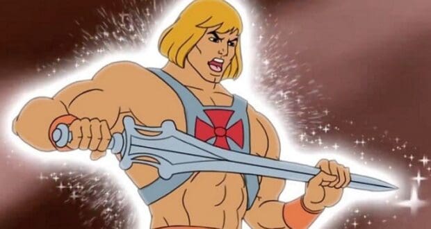 He-Man triumphantly lifts his glowing Power Sword under dazzling lights and sparkles, ready for adventure at Universal Studios.