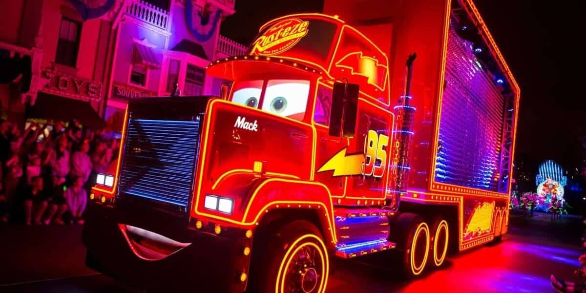 Mack from Cars dazzles with neon lights in Disneyland’s ‘Paint the Night’ Parade, as a fan leaps aboard and gets banned for life.