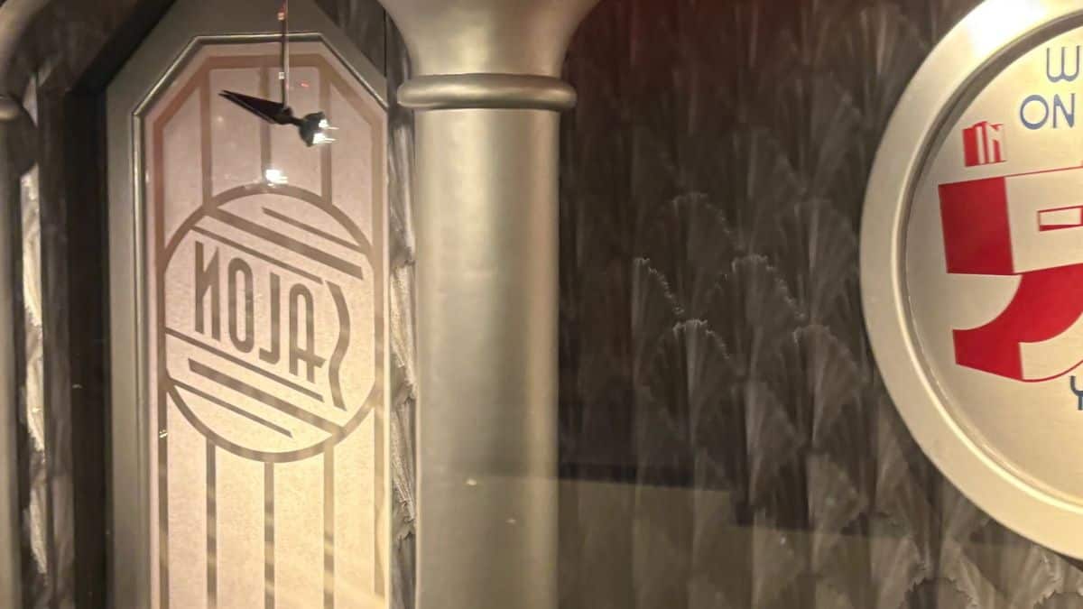 ALOJA entrance at Tomorrowland, with its vibrant door and signature signage on a lively patterned wall.