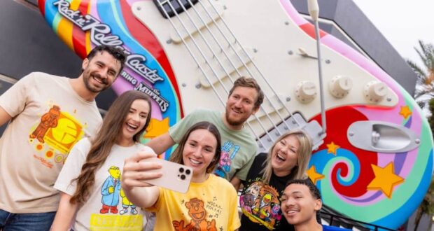 Fans pose for a selfie by the iconic Rock ‘n’ Roller Coaster guitar, pumped for Statler and Waldorf’s Muppets comeback.