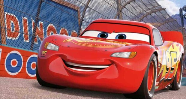 Lightning McQueen, smiling and racing on a track, inspired by the sold-out "Cars" Disney popcorn bucket collectible.